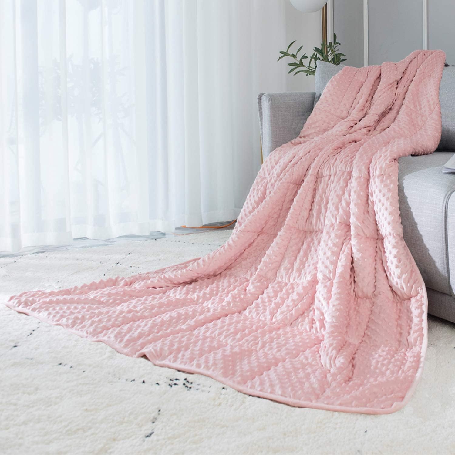 Unique Birthday Gifts for Her (That Aren't Flowers or Chocolate) 10 A Weighted Blanket in pink Color