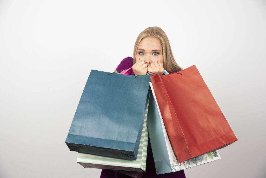 Sneakflation 2025: How to Evaluate Product like a pro 6 surprise women carrying shopping bag and worry about sneakflation